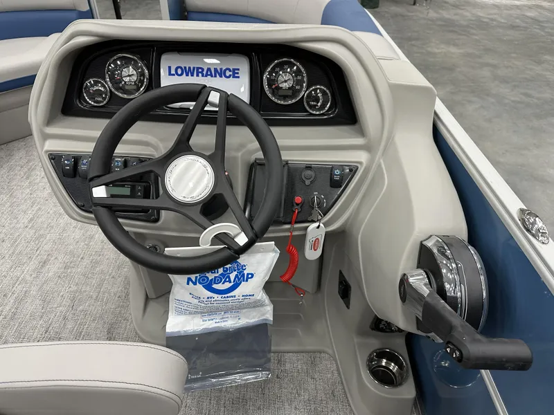 Slide: The Image of 2025 South Bay 222FCRLE boat dashboard with steering wheel and control panel. - 6
