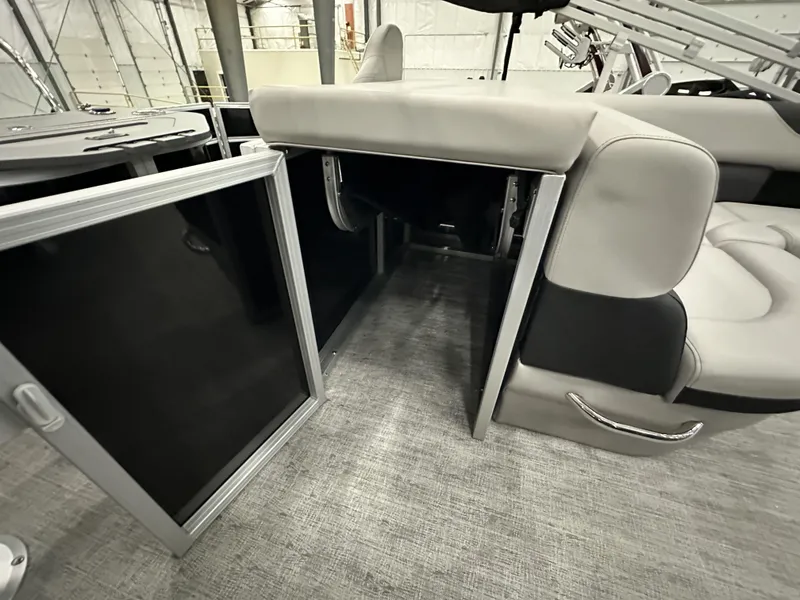 Slide: The Image of 2025 South Bay 224FCRLE boat interior with storage compartment and seating. - 12