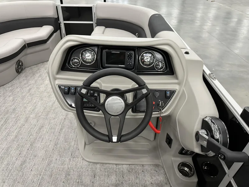 Slide: The Image of 2025 South Bay 224FCRLE boat dashboard with steering wheel and control panel. - 8