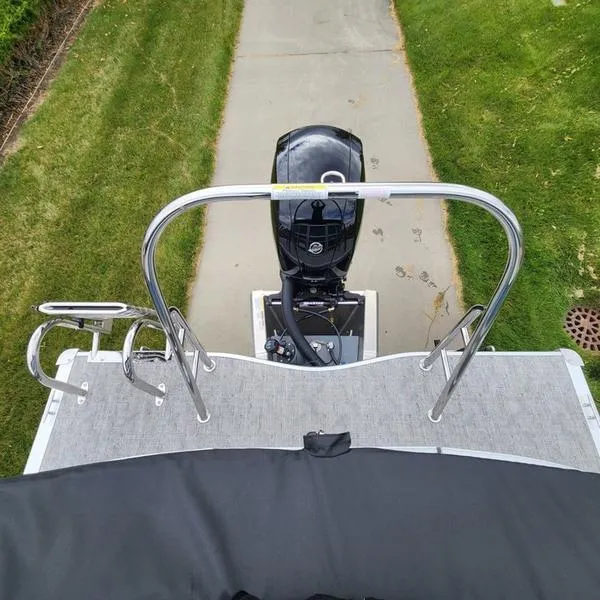 Slide: The Image of 2024 South Bay 222RS LE 2.75 pontoon boat with motor and railing, top view. - 14