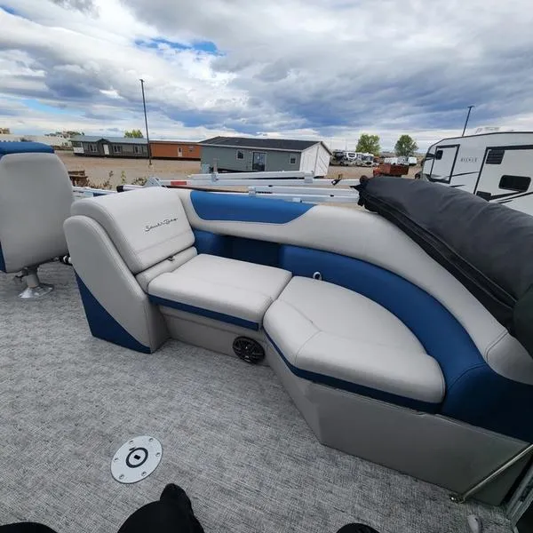 Slide: The Image of 2024 South Bay 222RS LE 2.75 pontoon boat interior with plush seating. - 15