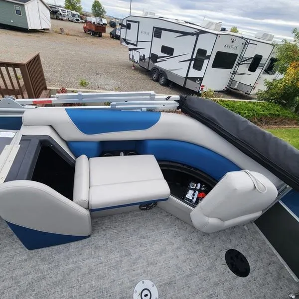 Slide: The Image of 2024 South Bay 222RS LE 2.75 pontoon boat interior with blue and gray seating. - 16