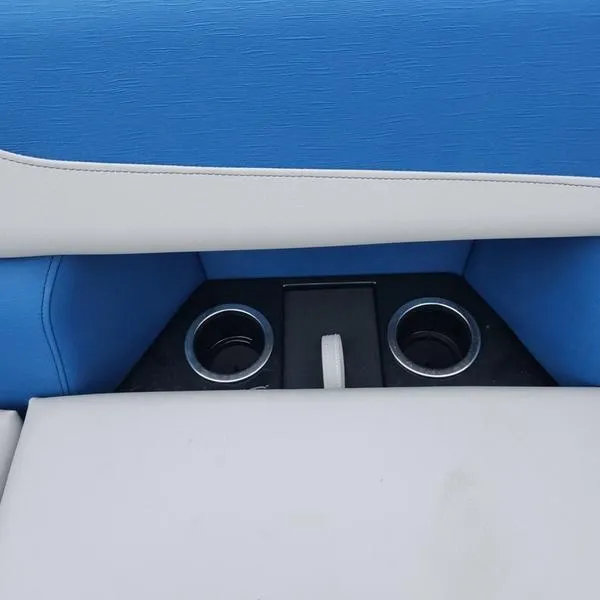 Slide: The Image of 2024 South Bay 222RS LE 2.75 boat seat with cup holders, blue and white upholstery. - 17