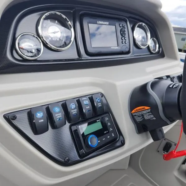 Slide: The Image of 2024 South Bay 222RS LE 2.75 boat dashboard with gauges and controls. - 20