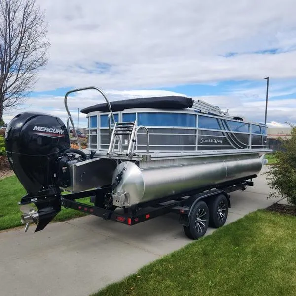 Slide: The Image of 2024 South Bay 222RS LE 2.75 pontoon boat on trailer with Mercury outboard. - 3