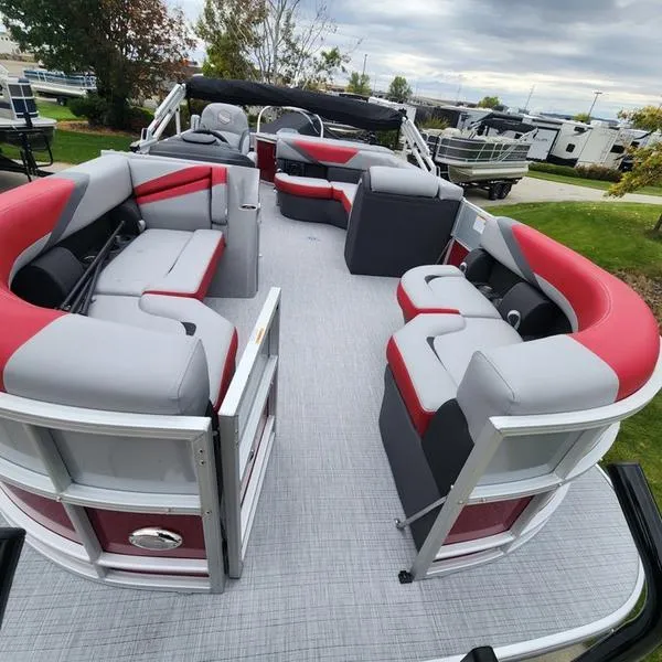 Slide: The Image of 2024 South Bay S224FCR 2.75 pontoon boat with red and gray seating, spacious deck. - 10