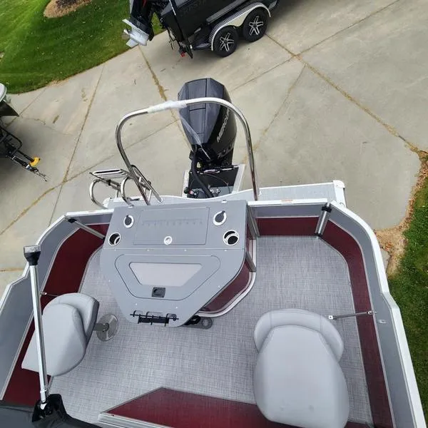 Slide: The Image of 2024 South Bay S224FCR 2.75 pontoon boat interior with helm and seating. - 13
