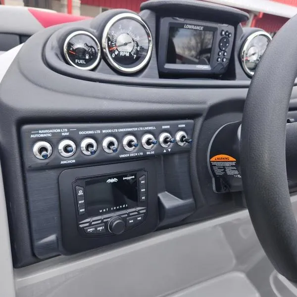 Slide: The Image of Dashboard of 2024 South Bay S224FCR 2.75 boat with gauges and controls. - 16