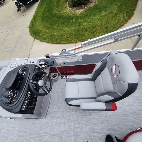 Slide: The Image of 2024 South Bay S224FCR 2.75 boat interior with steering console and captain's chair. - 18