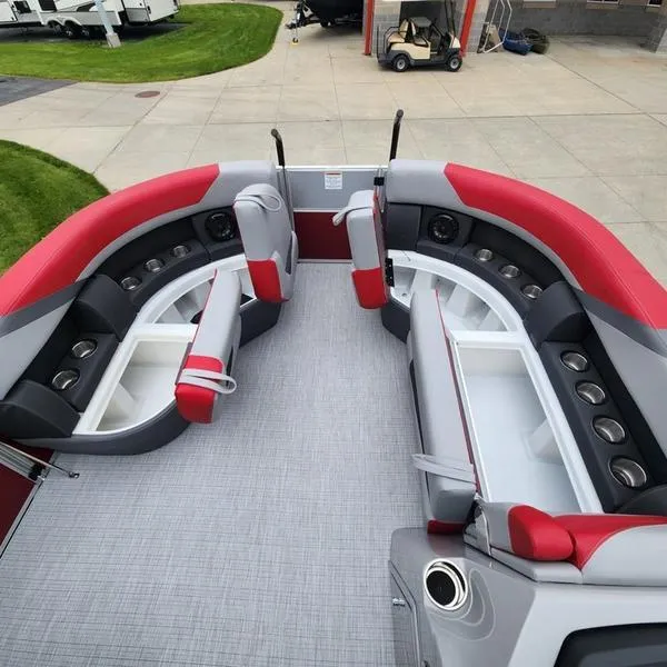 Slide: The Image of 2024 South Bay S224FCR 2.75 pontoon boat interior with red and gray seating. - 21