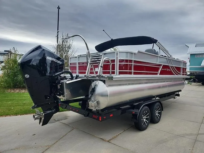 Slide: The Image of 2024 South Bay S224FCR 2.75 pontoon boat with Mercury engine on trailer. - 3