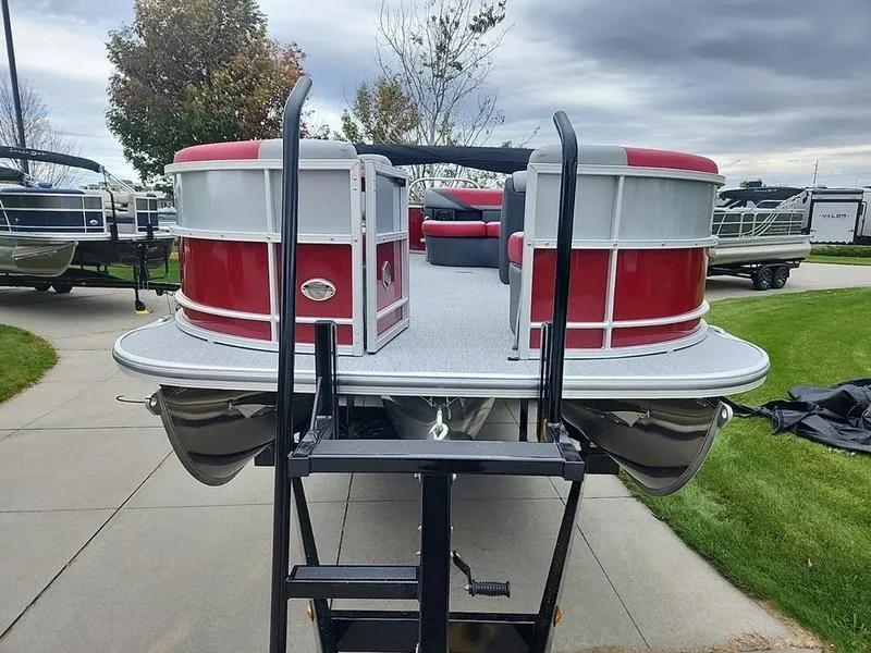 Slide: The Image of 2024 South Bay S224FCR 2.75 pontoon boat with red accents on display. - 9