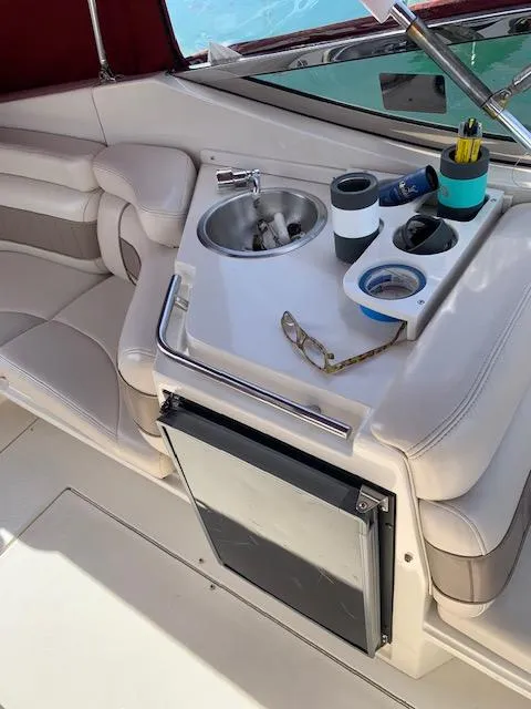 Slide: The Image of 1999 Regal 2850 LSC boat interior with sink and seating area. - 10