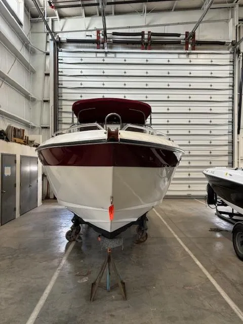 Slide: The Image of 1999 Regal 2850 LSC boat in storage facility, front view. - 15