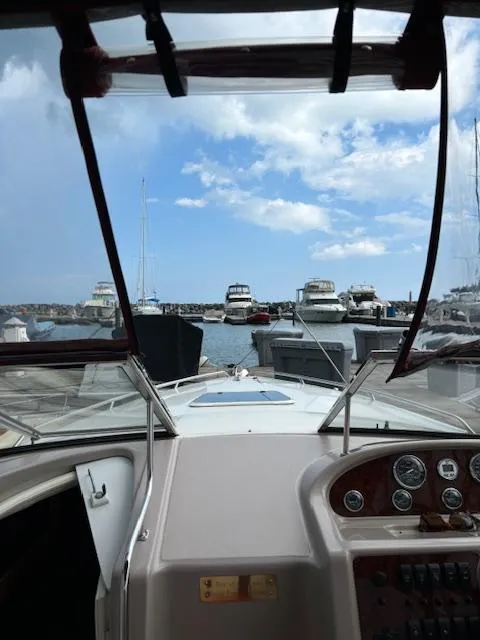 Slide: The Image of View from 1999 Regal 2850 LSC boat cockpit, overlooking marina with docked boats. - 6