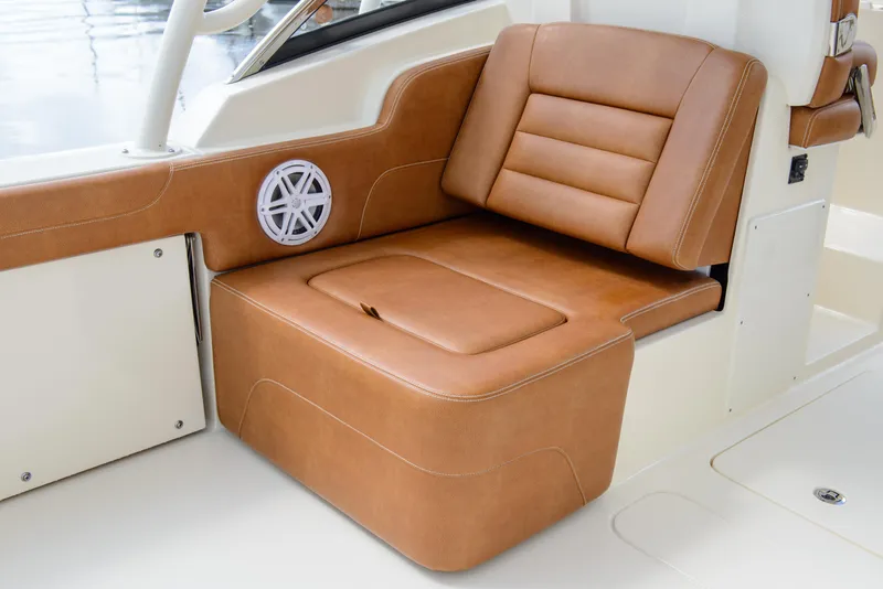 Slide: The Image of Luxurious tan leather seating on 2026 Scout 255 Dorado boat interior. - 21