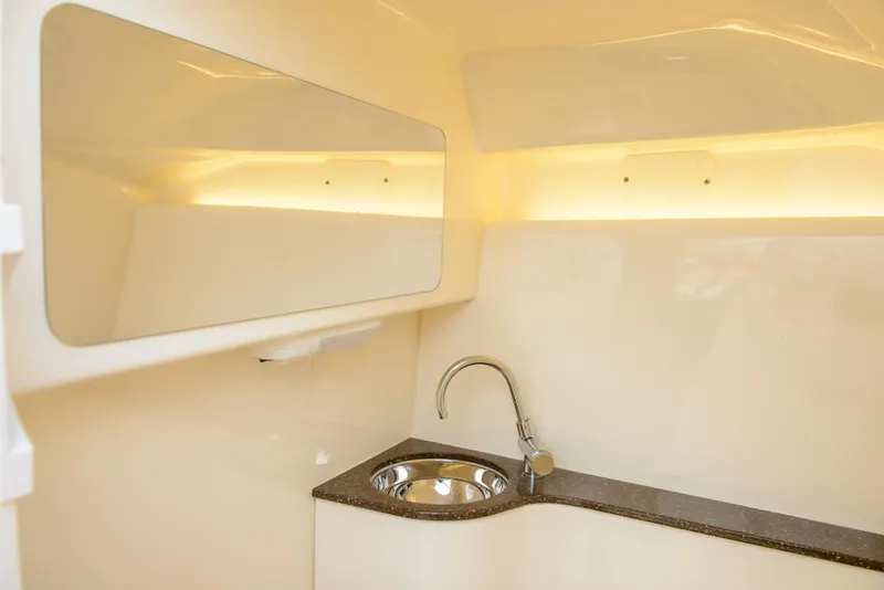 Slide: The Image of Interior of 2026 Scout 255 Dorado boat featuring a sleek sink and countertop. - 30