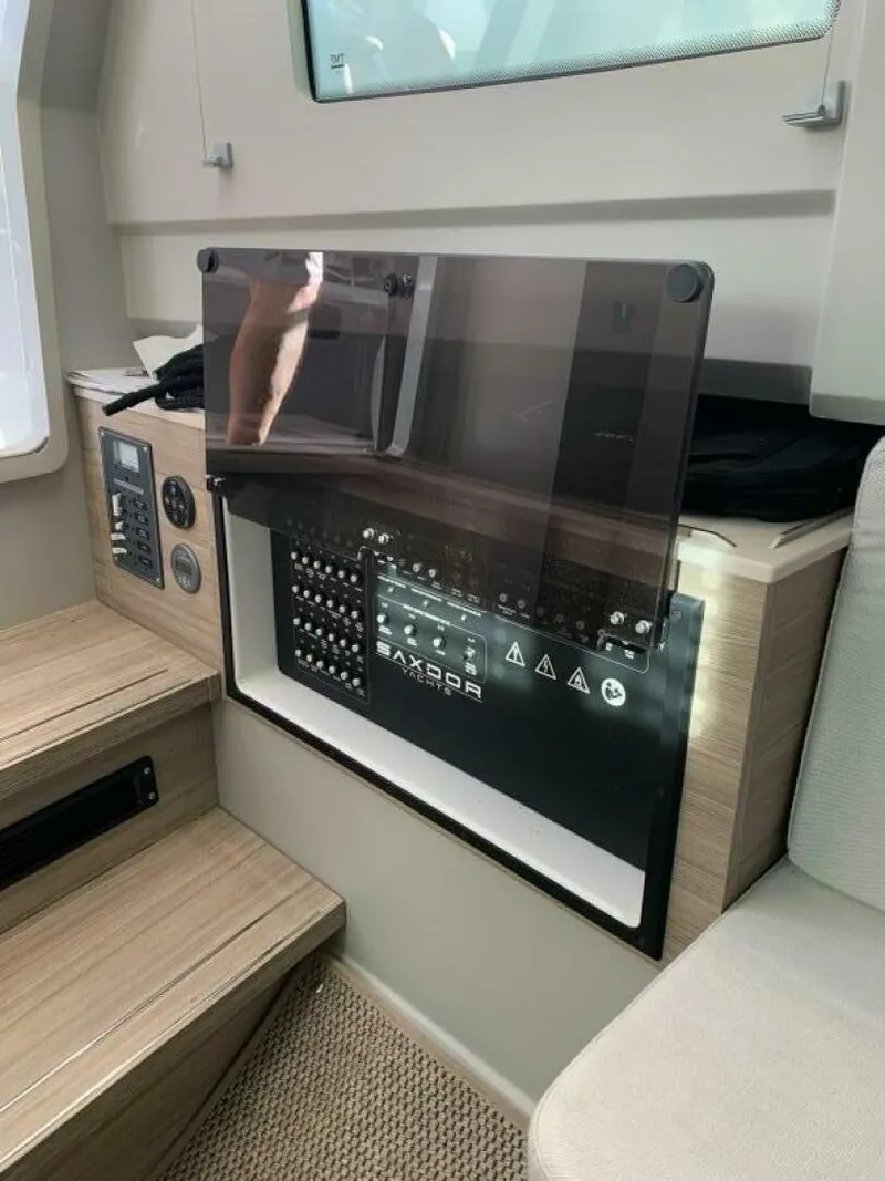 Slide: The Image of 2023 Saxdor 320 GTO interior control panel with modern design and wood accents. - 10
