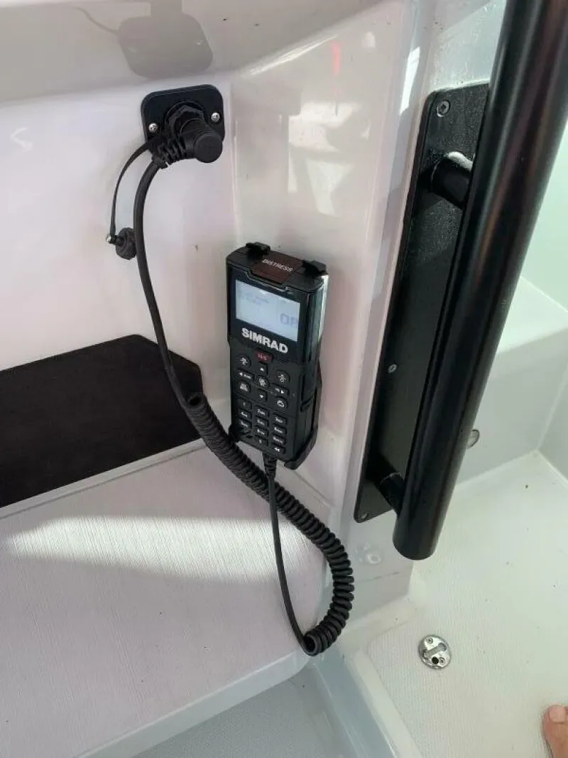 Slide: The Image of Simrad radio installed on 2023 Saxdor 320 GTO boat interior. - 13
