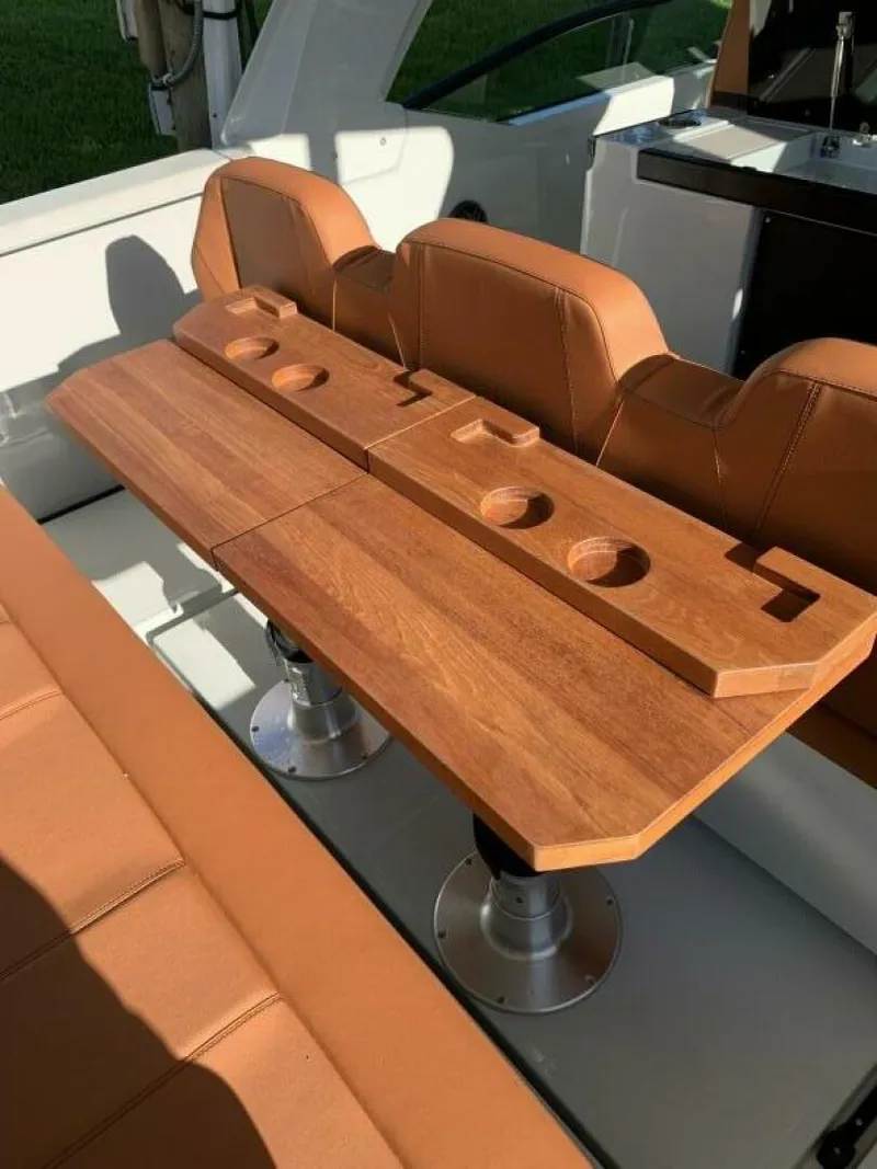 Slide: The Image of Luxury seating and wooden table on 2023 Saxdor 320 GTO boat. - 19