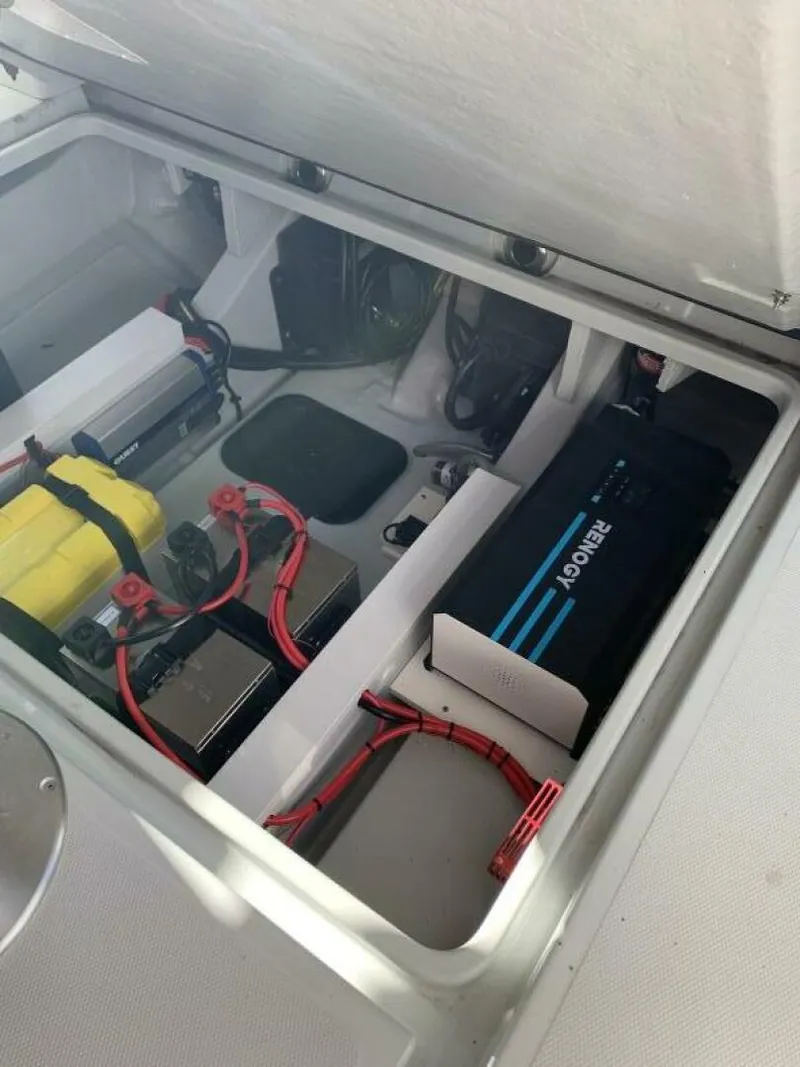 Slide: The Image of 2023 Saxdor 320 GTO battery compartment with wiring and components. - 23