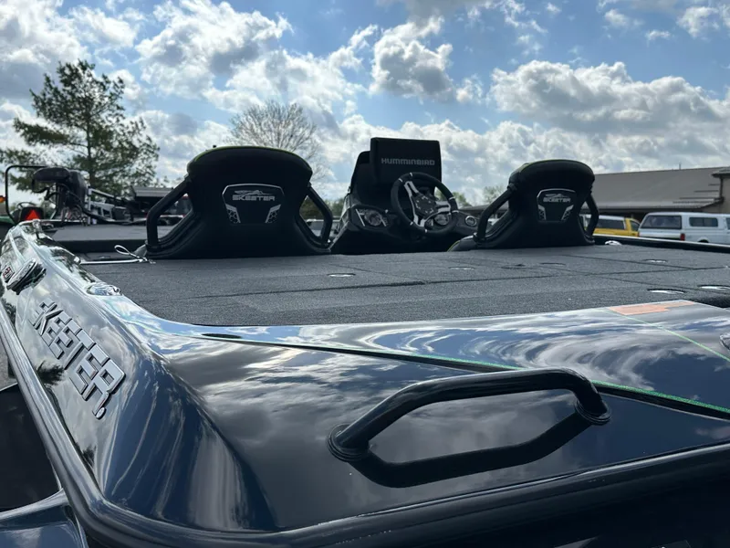 Slide: The Image of 2024 Skeeter FXR21 LE boat with dual seats under a cloudy sky. - 10
