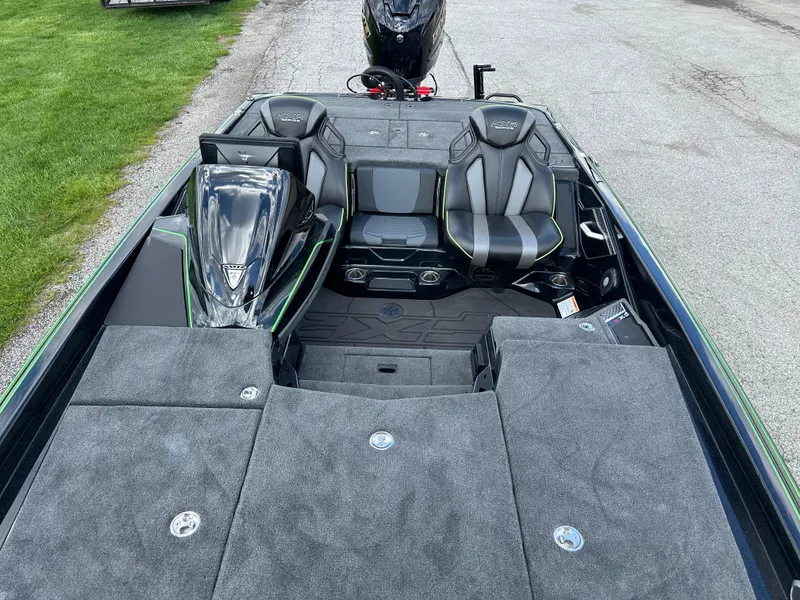 Slide: The Image of 2024 Skeeter FXR21 LE boat interior with dual seats and spacious deck. - 13