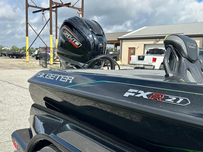 Slide: The Image of 2024 Skeeter FXR21 LE boat with Yamaha engine in outdoor setting. - 15