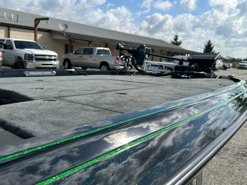 Slide: The Image of 2024 Skeeter FXR21 LE boat with sleek design and reflective finish. - 16
