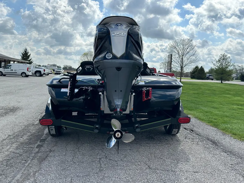 Slide: The Image of 2024 Skeeter FXR21 LE boat with powerful outboard motor on a trailer. - 2