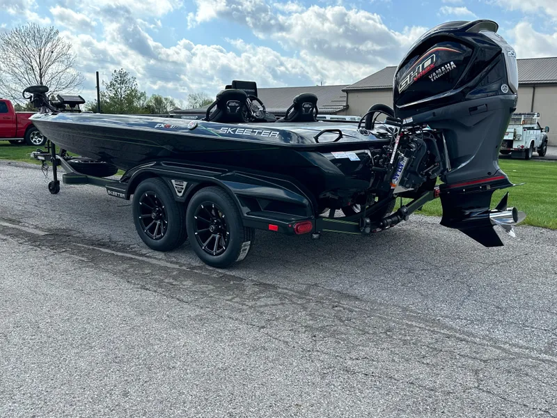 Slide: The Image of 2024 Skeeter FXR21 LE boat with Yamaha outboard motor on a trailer. - 3