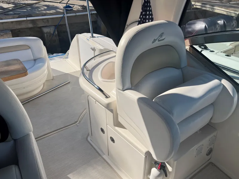 Slide: The Image of 2008 Sea Ray 340 Sundancer boat interior with plush seating and helm station. - 13
