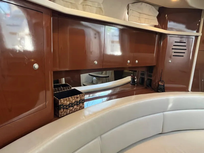 Slide: The Image of Luxurious interior of 2008 Sea Ray 340 Sundancer with polished wood cabinets and plush seating. - 19