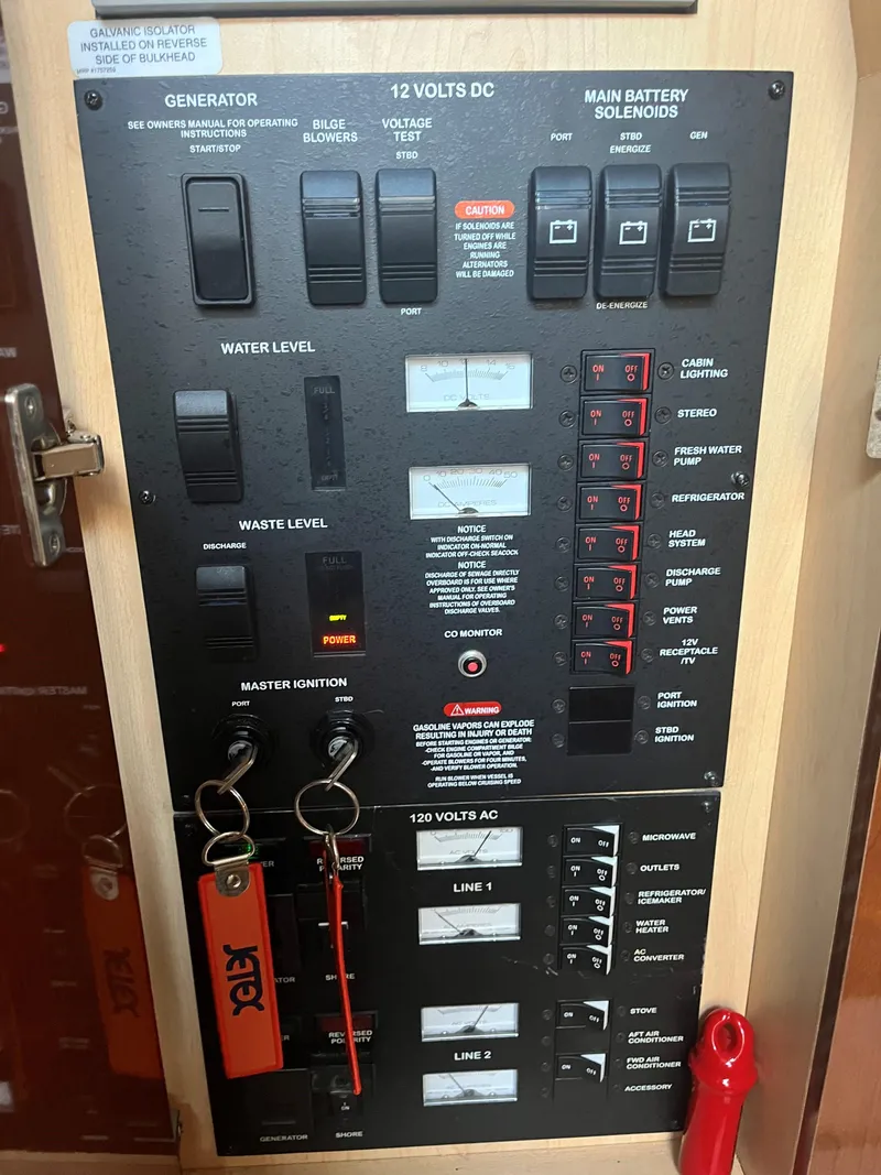 Slide: The Image of Control panel of a 2008 Sea Ray 340 Sundancer boat, featuring various switches and indicators. - 27