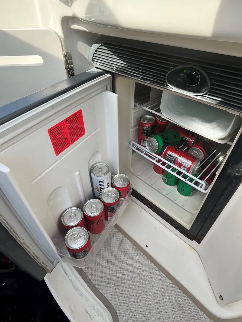 Slide: The Image of Mini fridge stocked with canned drinks on a 2008 Sea Ray 340 Sundancer boat. - 30