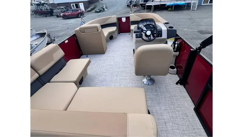 Slide: The Image of 2025 Lowe LS170 boat interior with beige seating and steering console. - 6