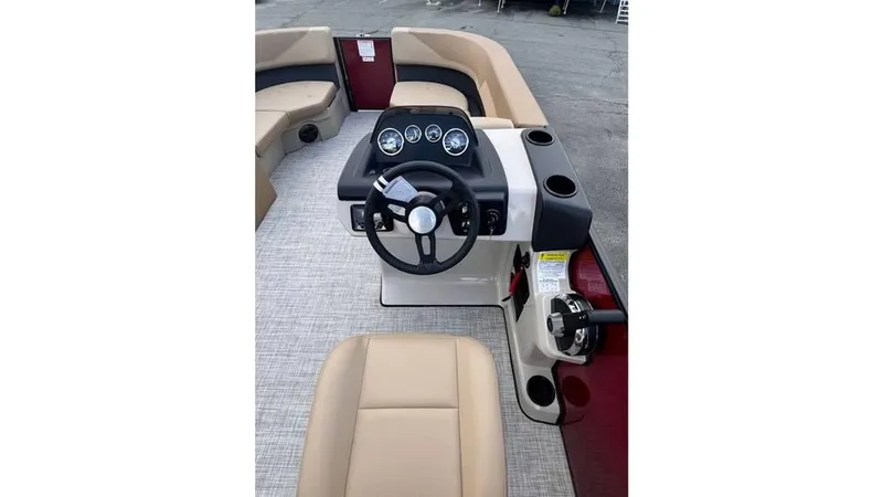 Slide: The Image of 2025 Lowe LS170 boat interior with steering wheel and seating. - 7