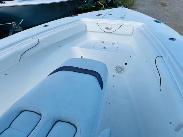 Slide: The Image of 2019 Sea Hunt Gamefish 27 with Coffin Box, docked under a partly cloudy sky. - 12