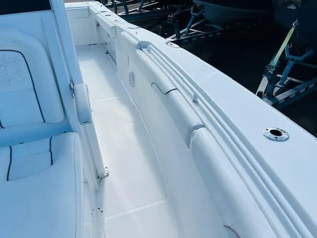 Slide: The Image of 2019 Sea Hunt Gamefish 27 boat interior with toilet and storage area. - 15