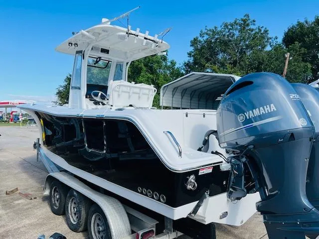Slide: The Image of 2019 Sea Hunt Gamefish 27 boat interior with console and storage. - 4