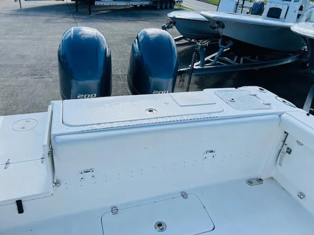 Slide: The Image of 2019 Sea Hunt Gamefish 27 boat with white cushioned seating. - 6