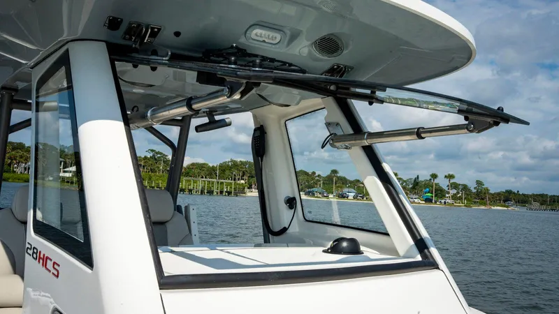 Slide: The Image of 2025 Solace 28 HCS boat on a serene lake. - 3
