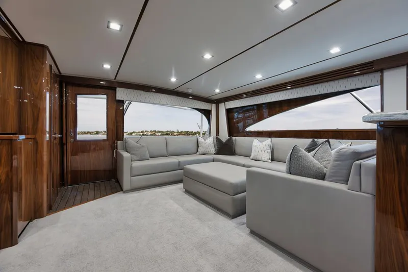 Slide: The Image of Luxurious interior of 2019 Viking 80 Convertible yacht with elegant seating and wood finishes. - 11