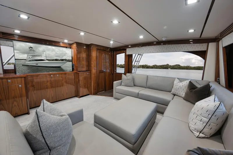 Slide: The Image of Luxurious interior of 2019 Viking 80 Convertible yacht with plush seating and elegant wood finishes. - 12