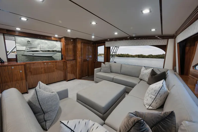 Slide: The Image of Luxurious interior of 2019 Viking 80 Convertible yacht with plush seating and elegant wood finishes. - 13