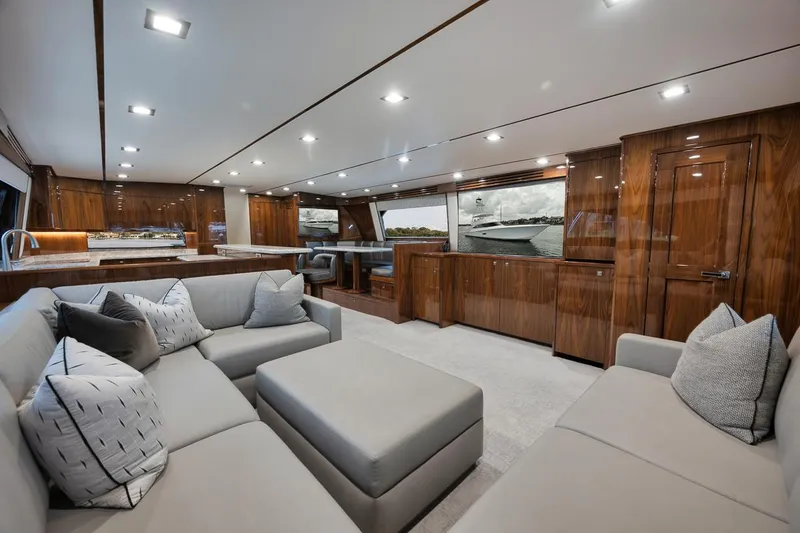 Slide: The Image of Luxurious interior of 2019 Viking 80 Convertible yacht with modern furnishings and wood finishes. - 15