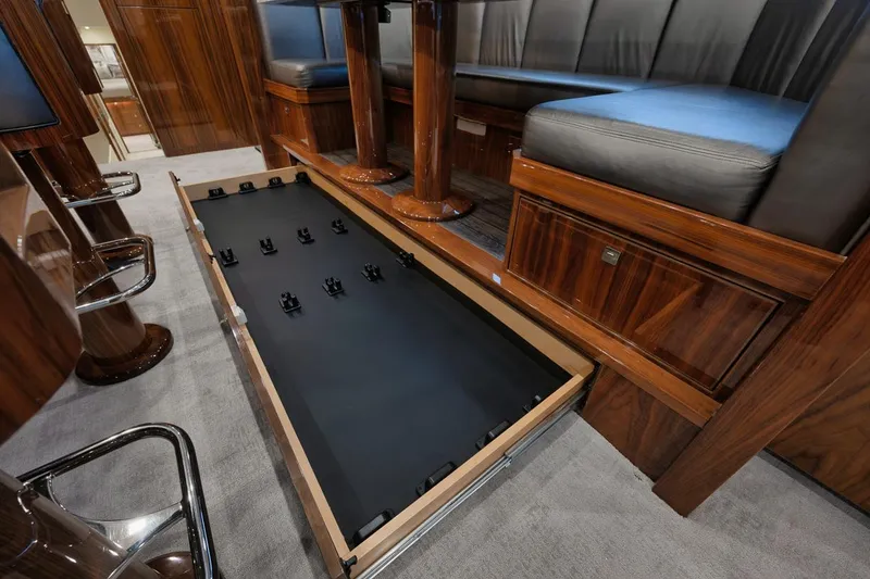 Slide: The Image of Luxurious interior of 2019 Viking 80 Convertible yacht with hidden storage compartment. - 20