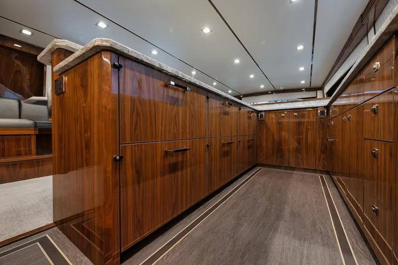 Slide: The Image of Luxurious interior of 2019 Viking 80 Convertible yacht with elegant wood cabinetry. - 22