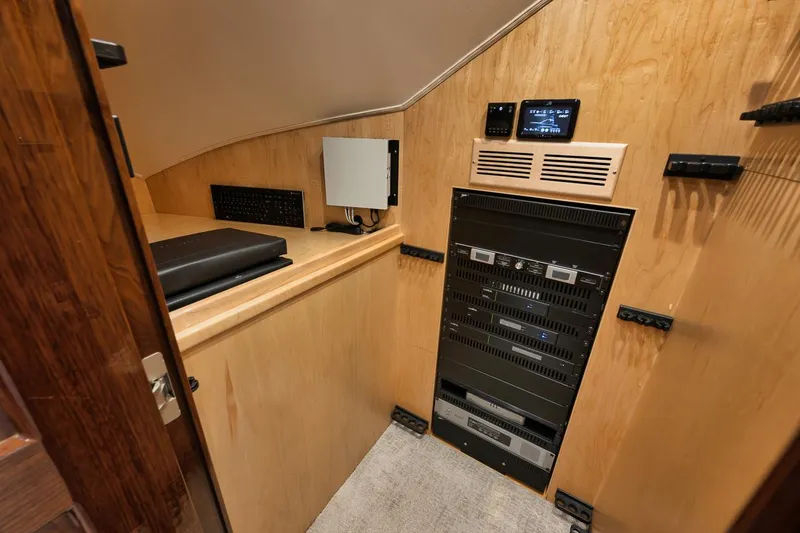 Slide: The Image of 2019 Viking 80 Convertible yacht interior with modern control panel and equipment. - 25