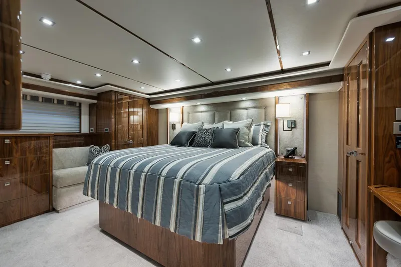 Slide: The Image of Luxurious bedroom interior of 2019 Viking 80 Convertible yacht with elegant wood finishes. - 33